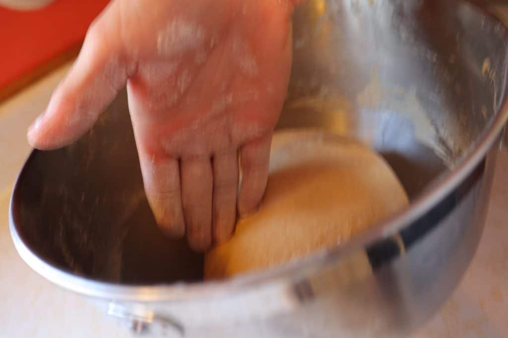 Separating bread dough into two loaves without a dough scraper