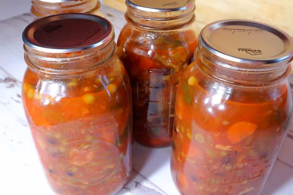 jars of home canned leftover soup in mason jars