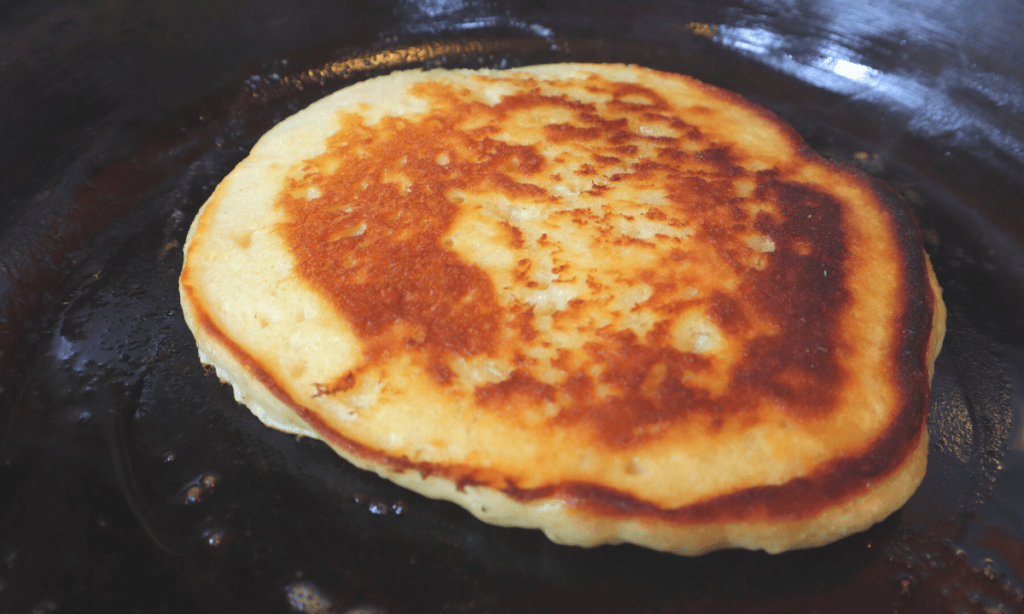 pancake finished cooking in cast iron skillet