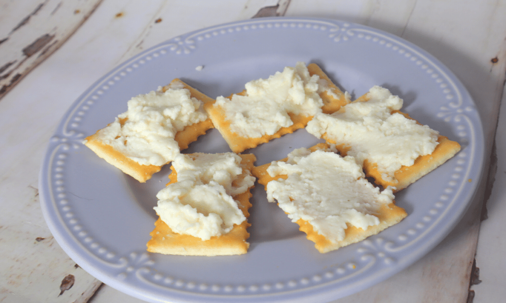 soft cheese on crackers