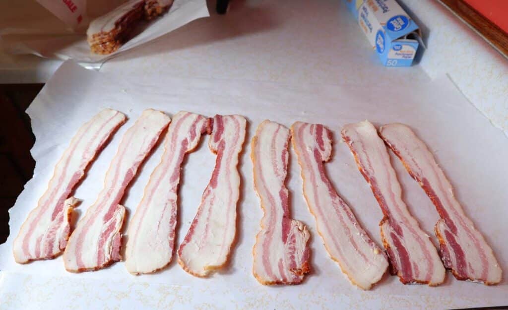lining bacon on parchment paper