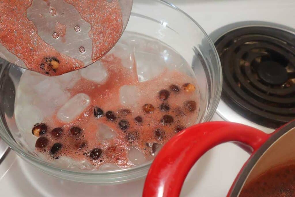blanching hazelnuts into ice water
