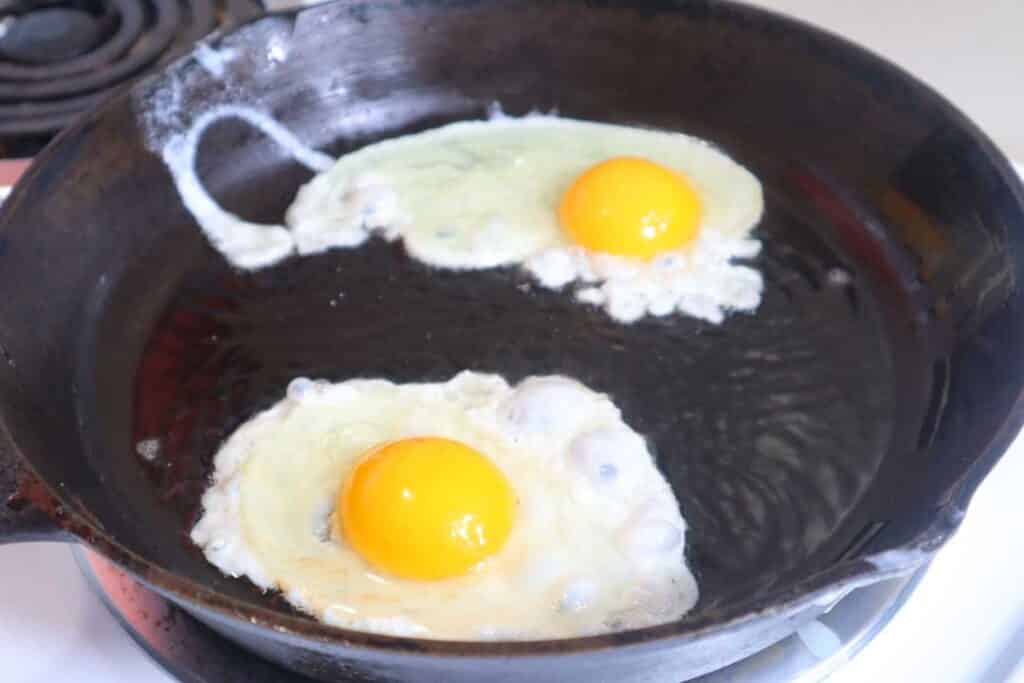 frying pasture raised eggs in cast iron skillet